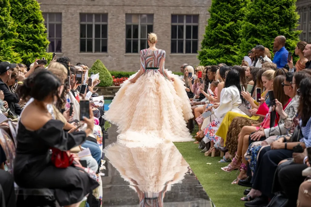 Runway model in elegant dress at outdoor show
