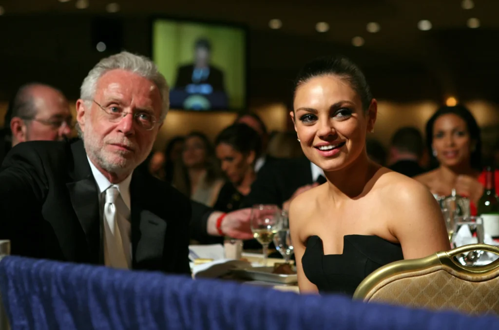 Formal event attendees at a gala dinner.