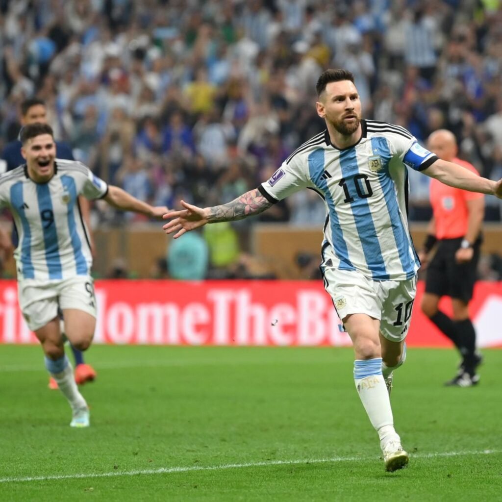 Soccer player celebrating goal on field.