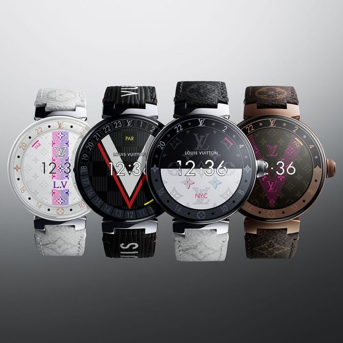 Four luxury watches with different designs displayed.
