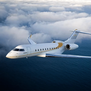 Private jet flying above clouds over ocean.