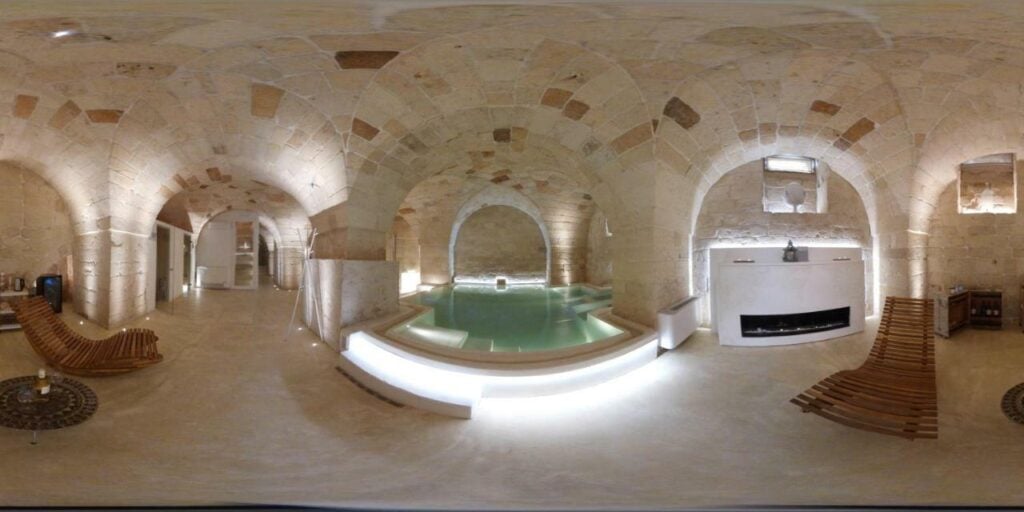 Luxurious stone spa with indoor pool