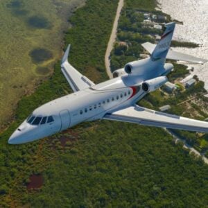 Private jet flying over landscape