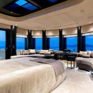 Luxury bedroom with ocean view and modern decor.