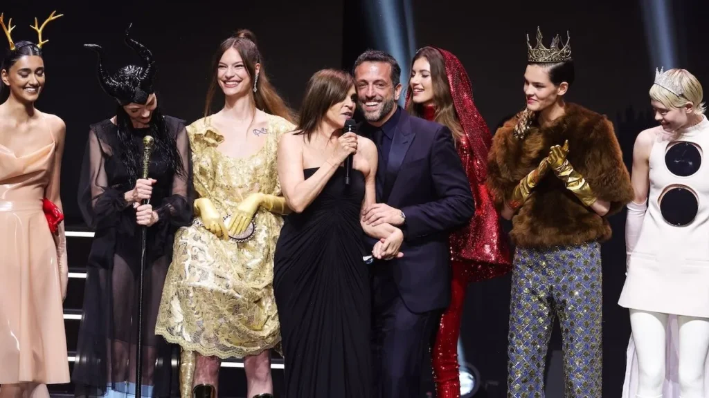 Fashion event with creatively dressed models on stage.