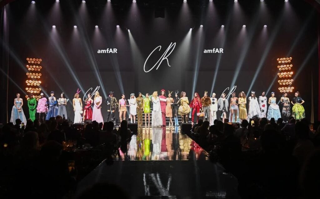 Fashion models on stage during amfAR event.