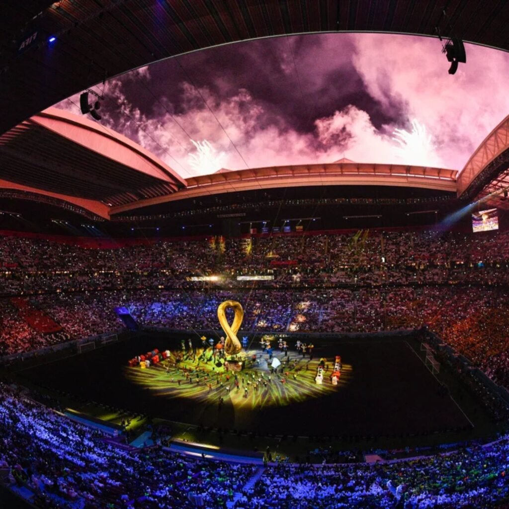 Stadium celebration with colorful lighting and crowd.
