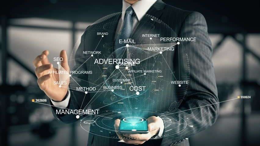 Businessman with holographic digital marketing interface.