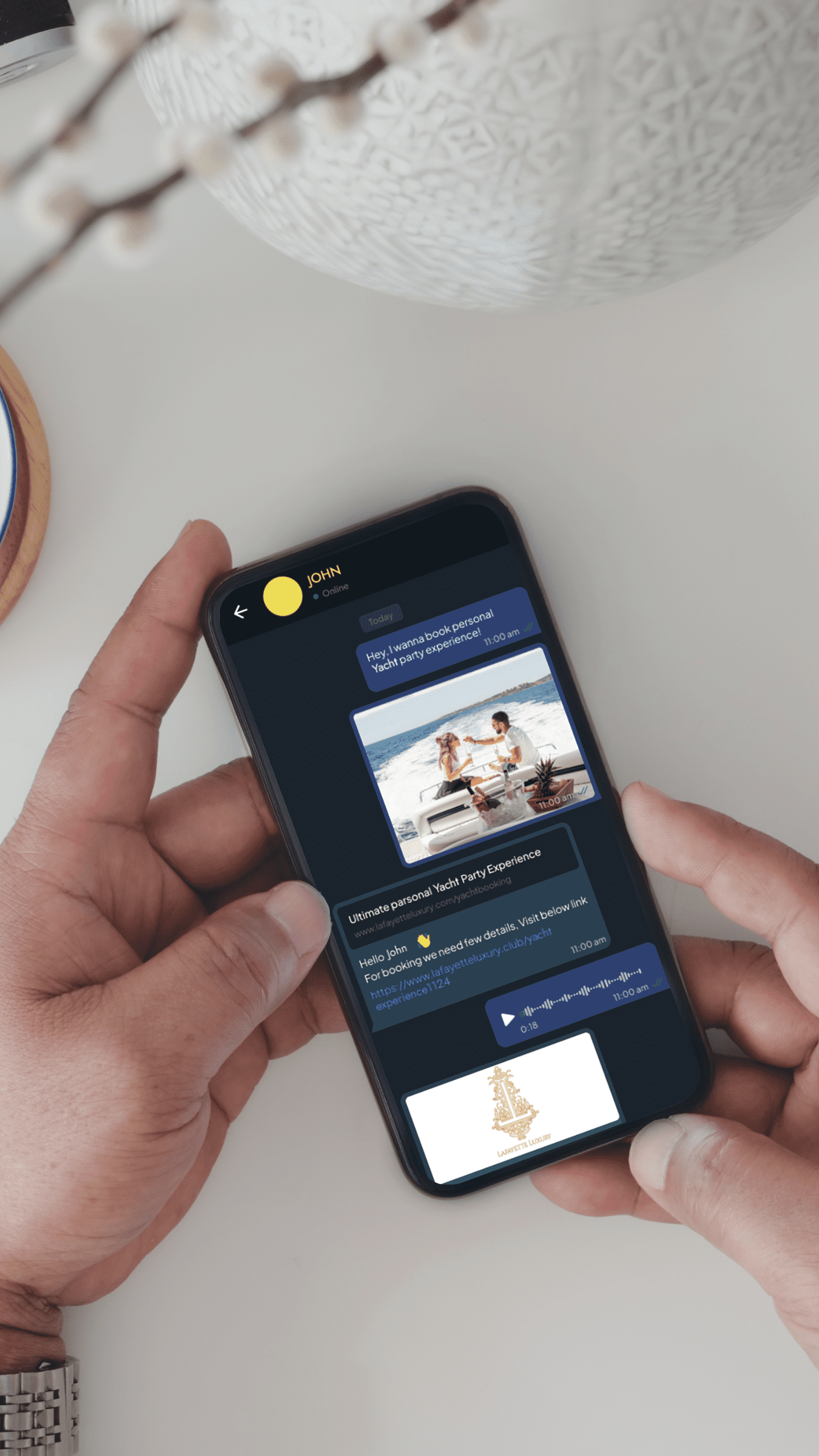 Hands holding smartphone with yacht booking app.