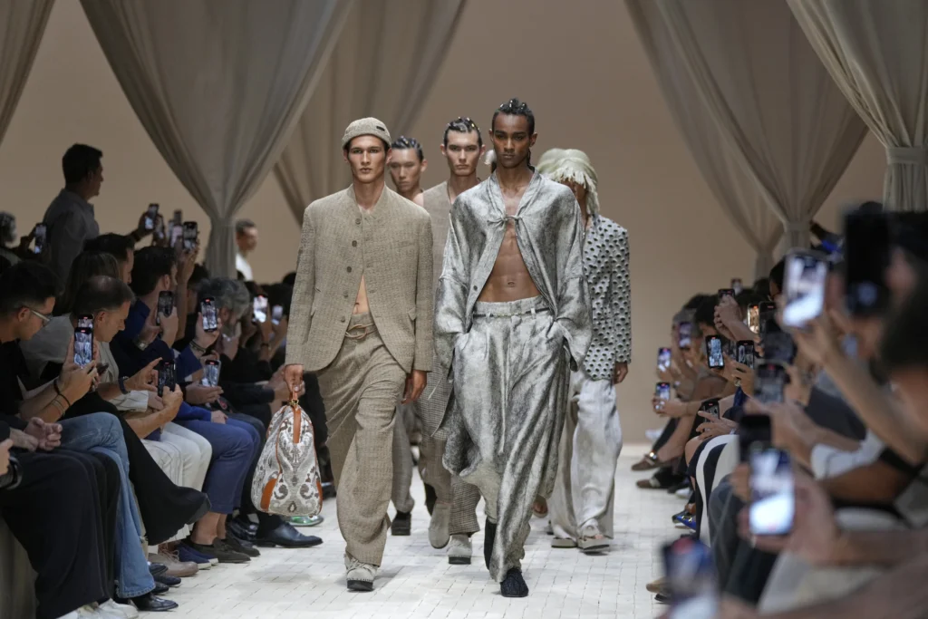 Fashion models walking down a runway