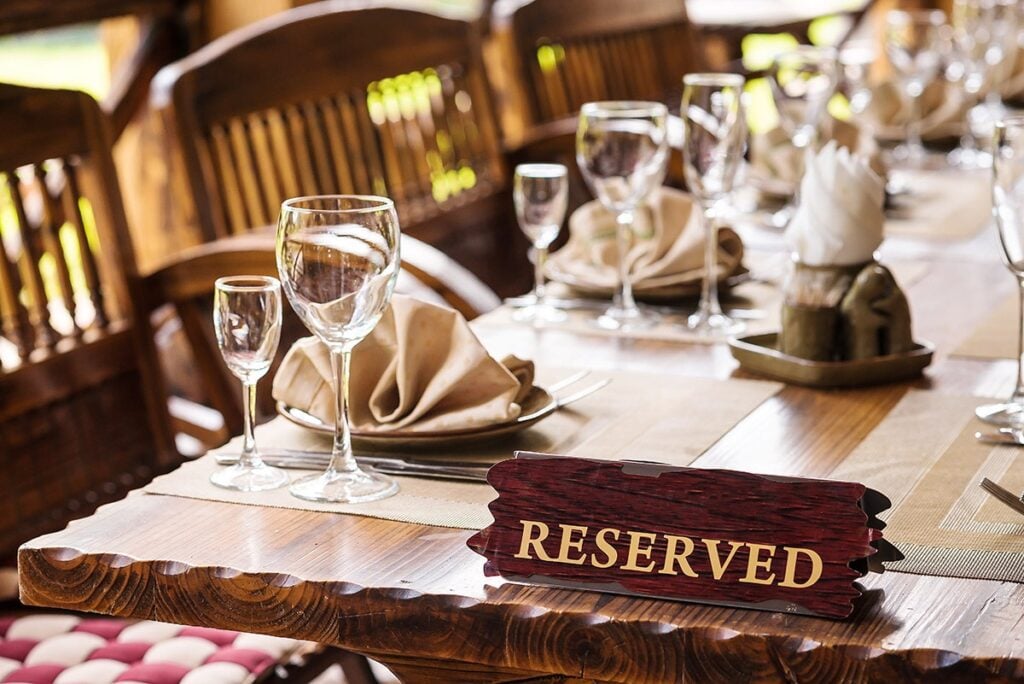Reserved sign on set restaurant table