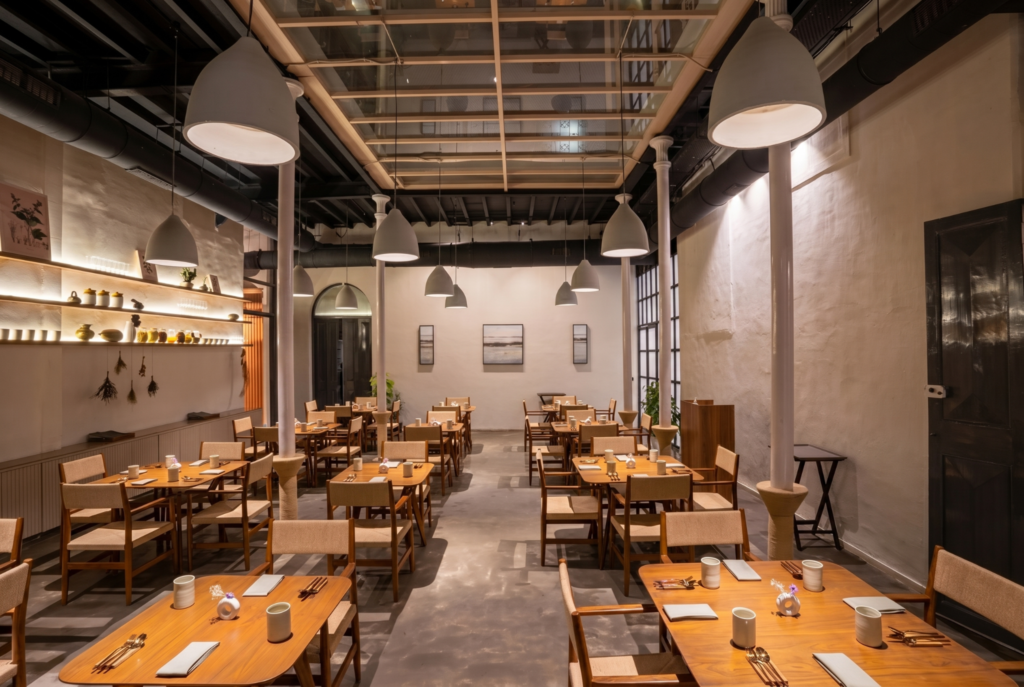 Modern minimalist restaurant interior with wooden tables