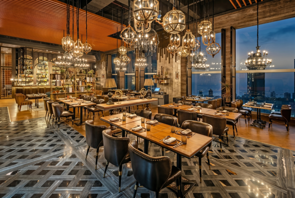Elegant restaurant interior with chandeliers and city view