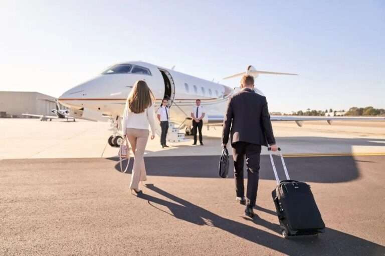 People boarding private jet at airport