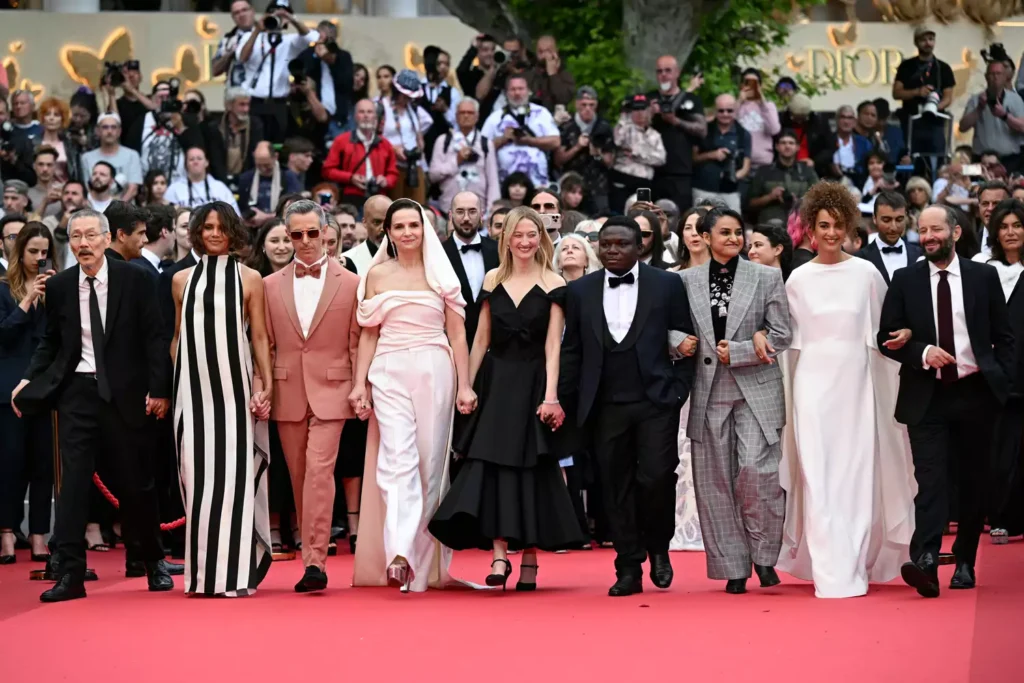 Group on red carpet at film festival.