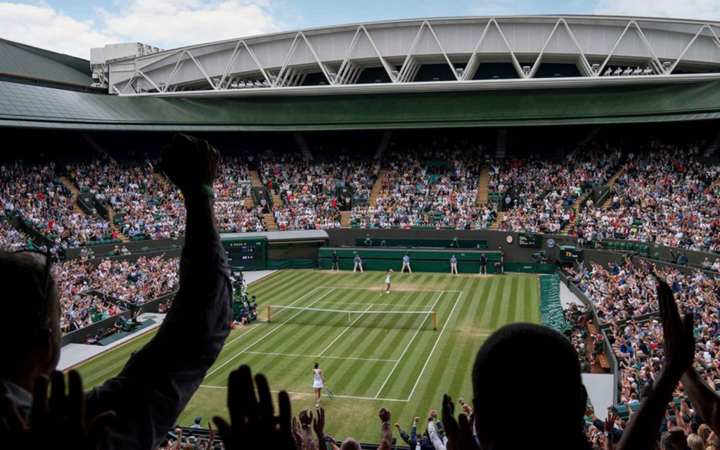 Tennis match at a packed stadium