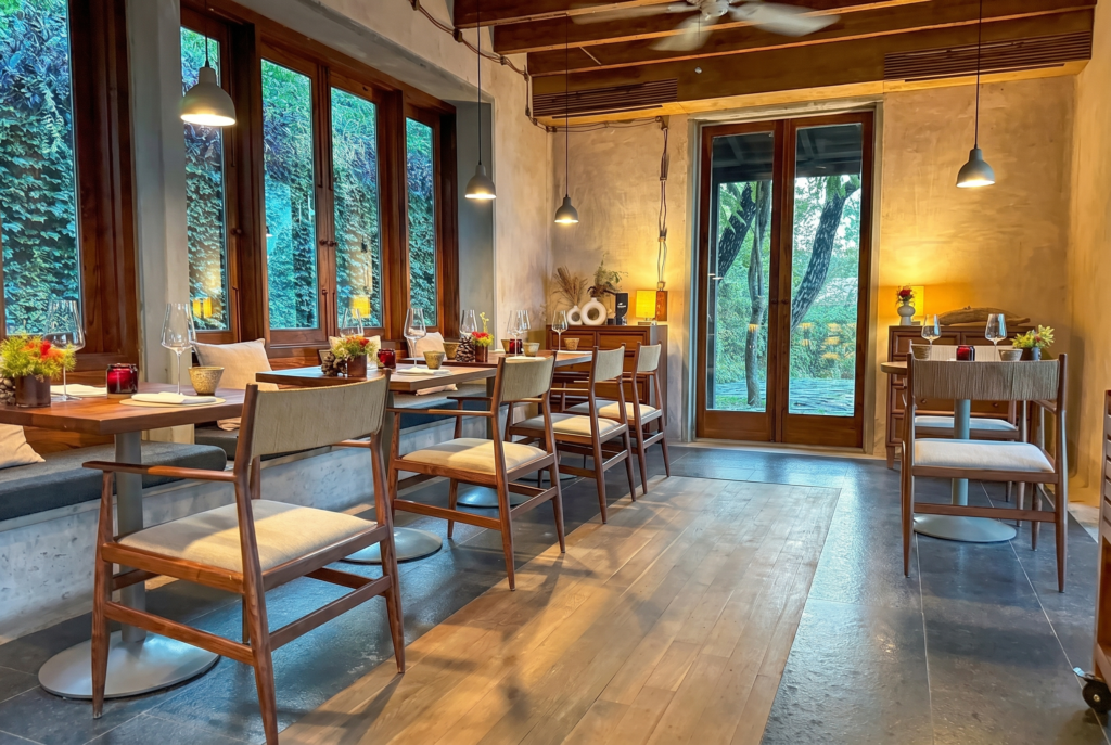 Cozy modern restaurant interior with wooden tables and windows