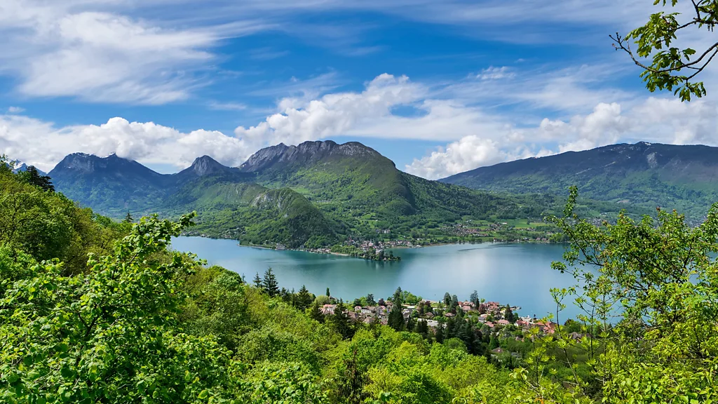 Mountain lake surrounded by lush green hills