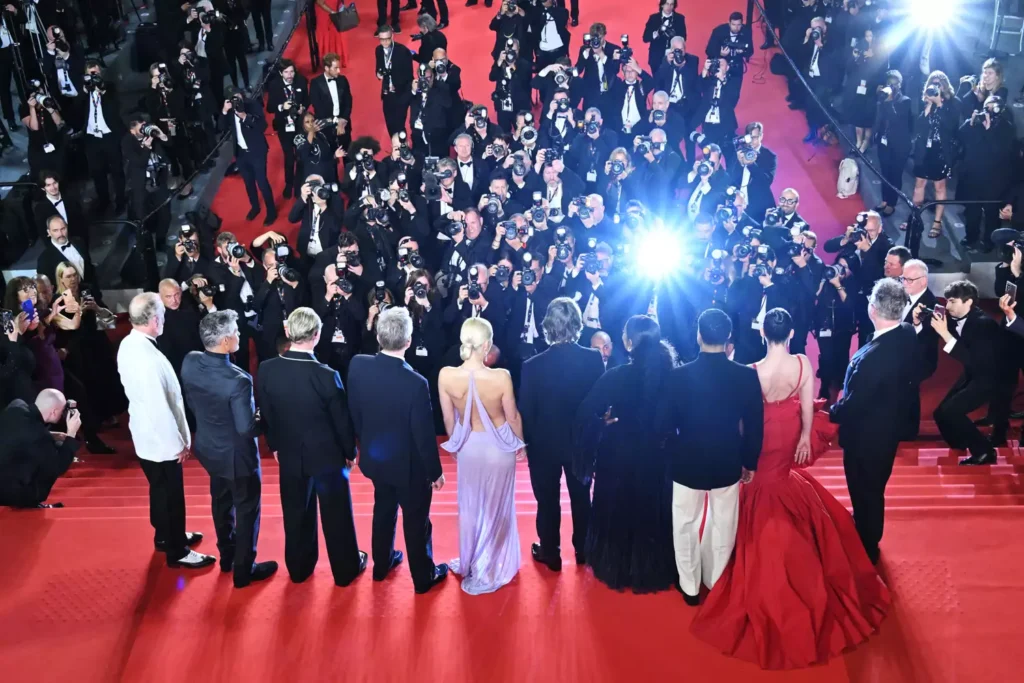 Celebrities pose on red carpet for paparazzi