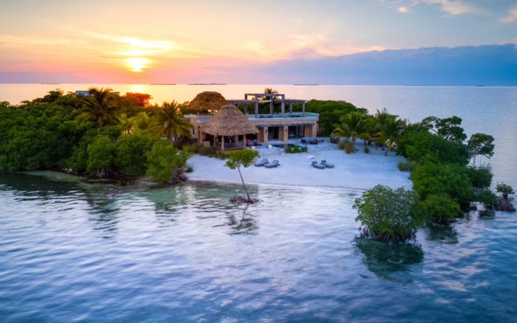 Tropical island at sunset with lush greenery