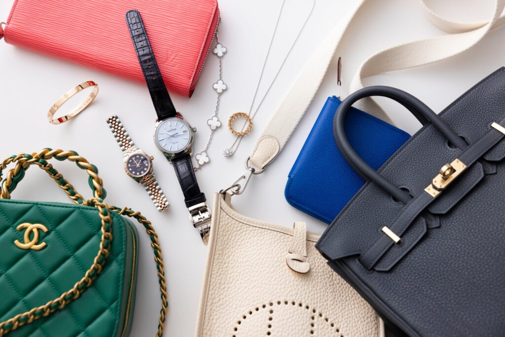 Luxury handbags, watches, and jewelry flat lay