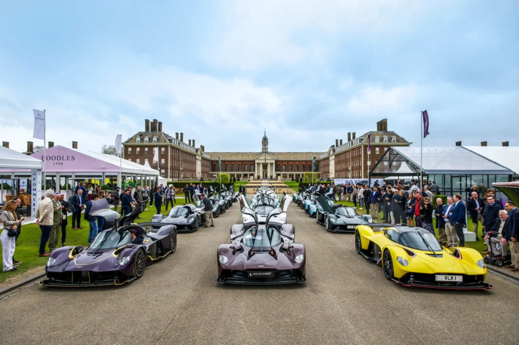 Luxury cars displayed at an outdoor event.