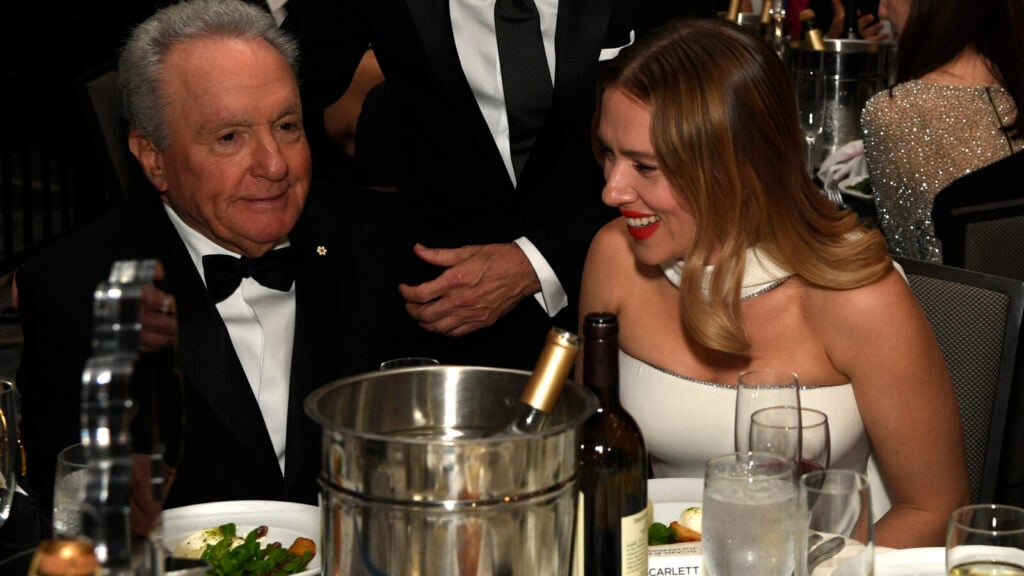 Two people dining at a formal event.